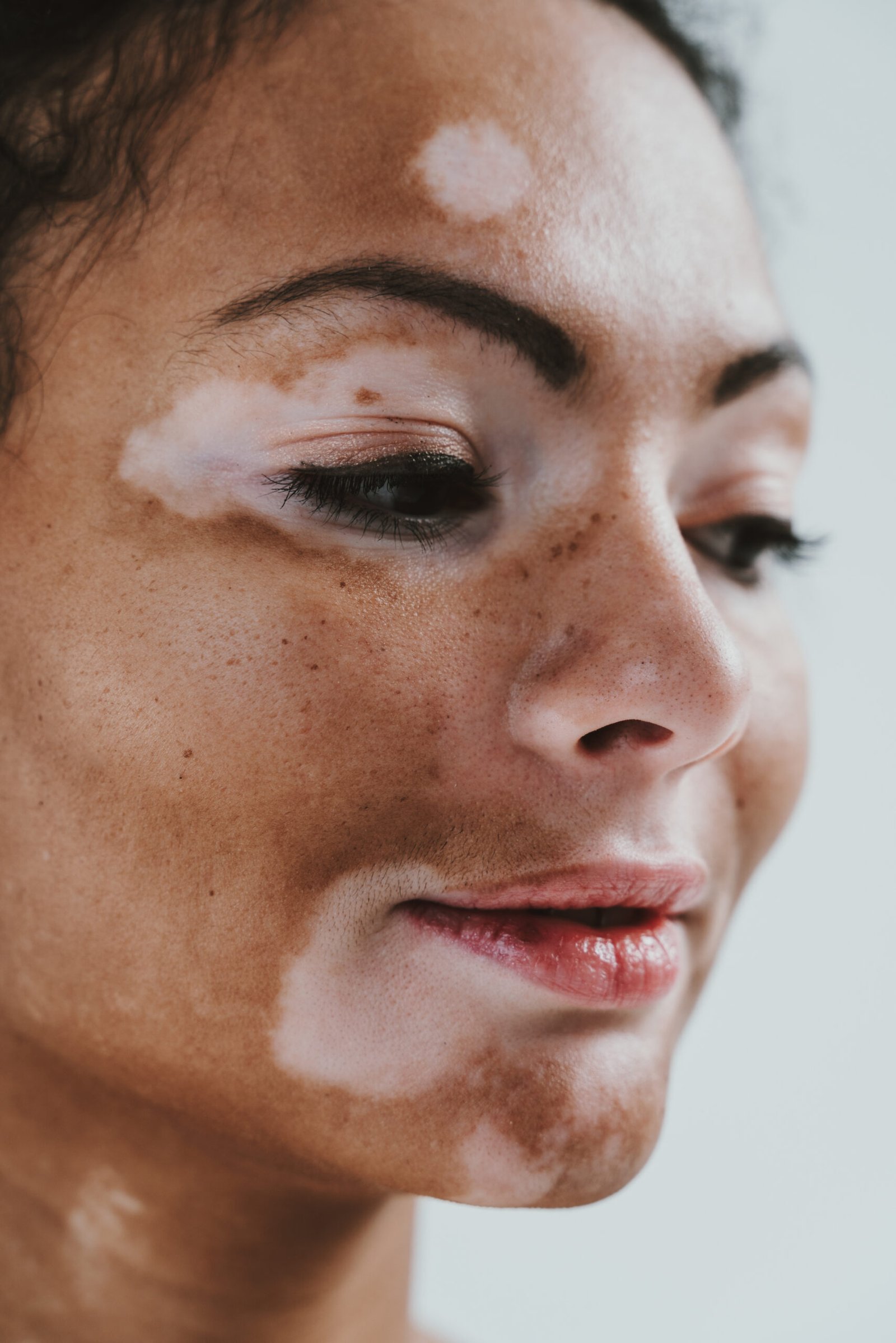 Beautiful woman with natural skin showing diversity at Couture Dermatology