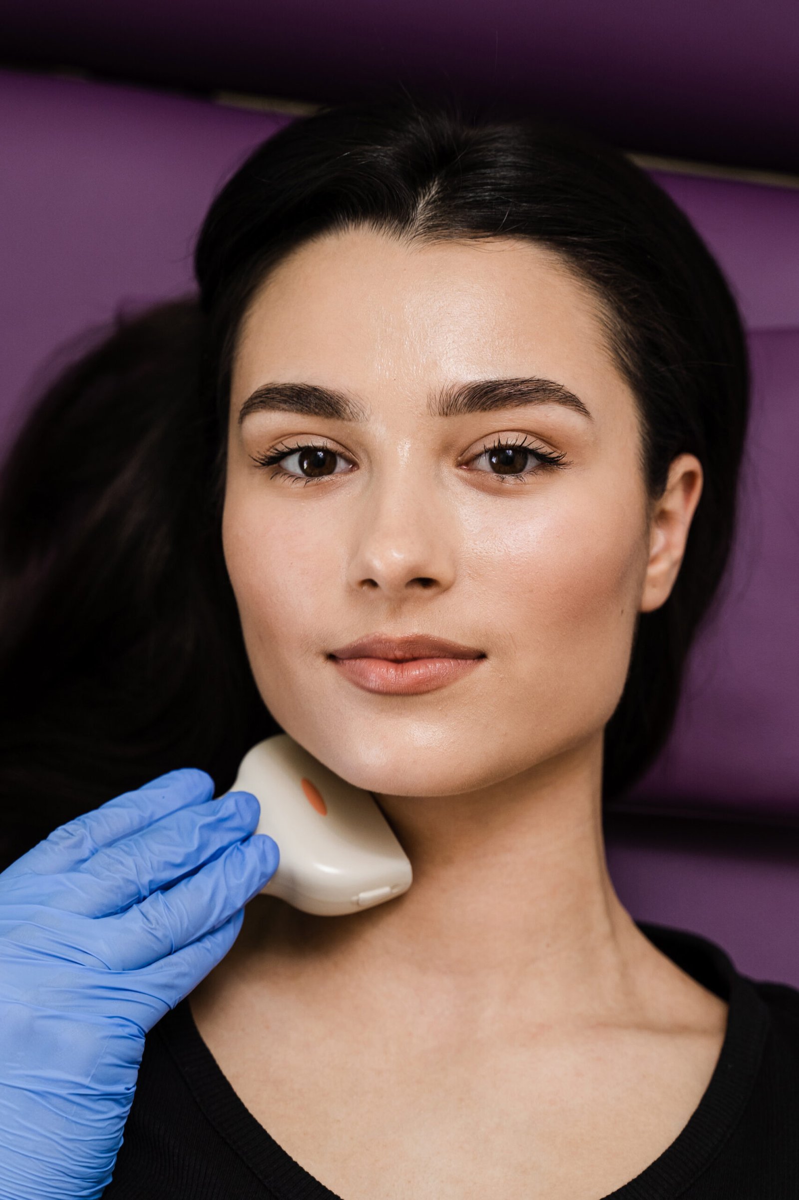 Dermatologist performing injectable jawline treatment at Couture Dermatology Beverly Hills